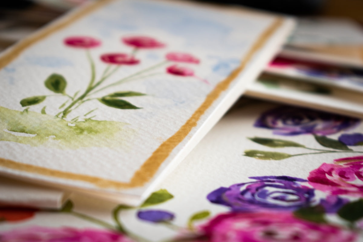 white green and pink floral textile