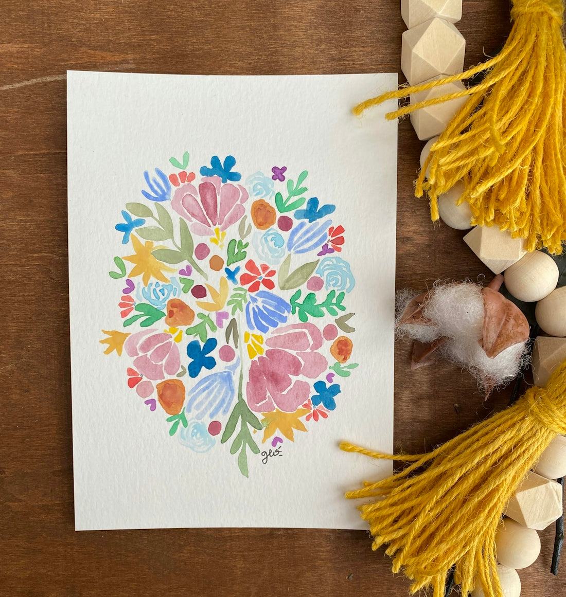 a card with a colorful floral design on it