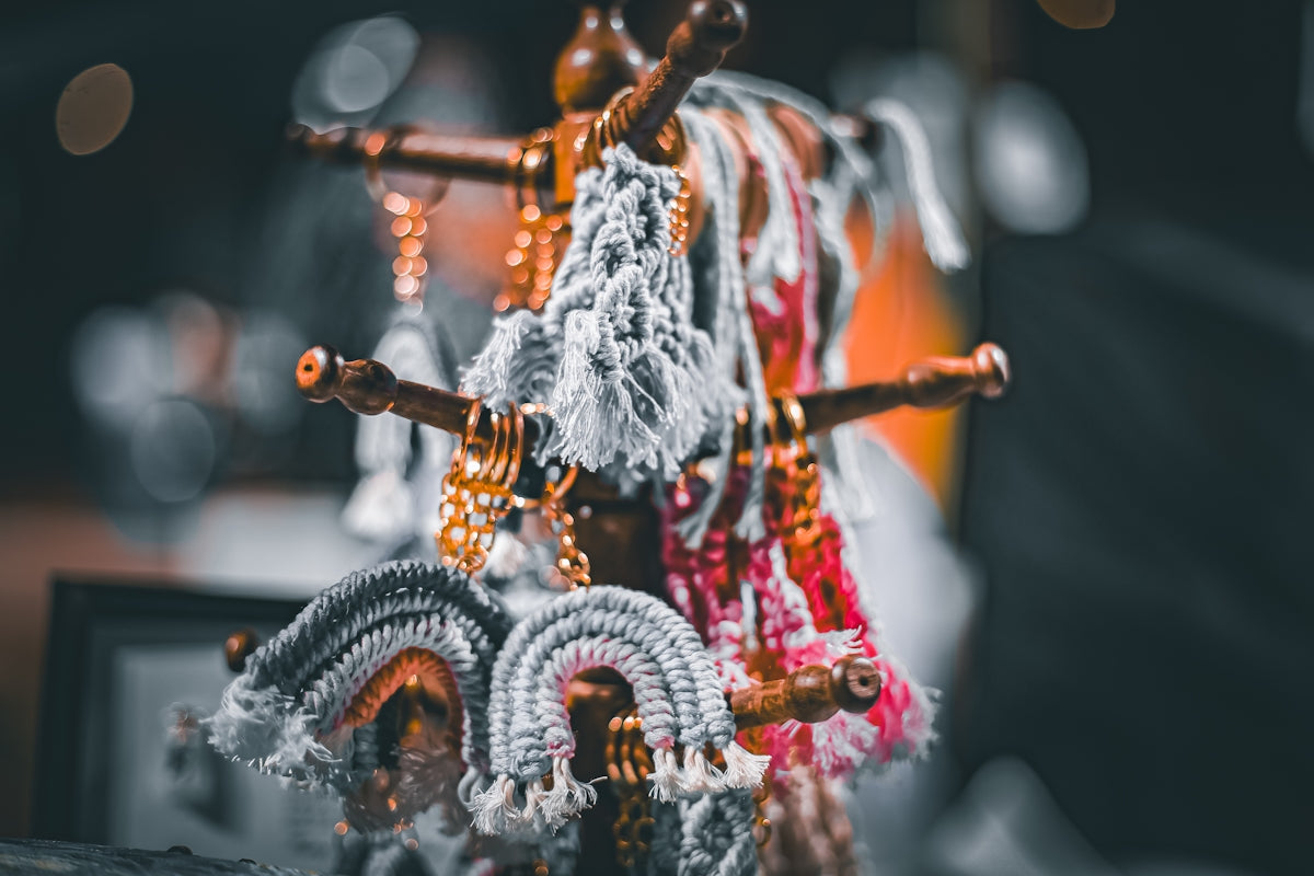 Accessories hang from a decorative wooden stand.