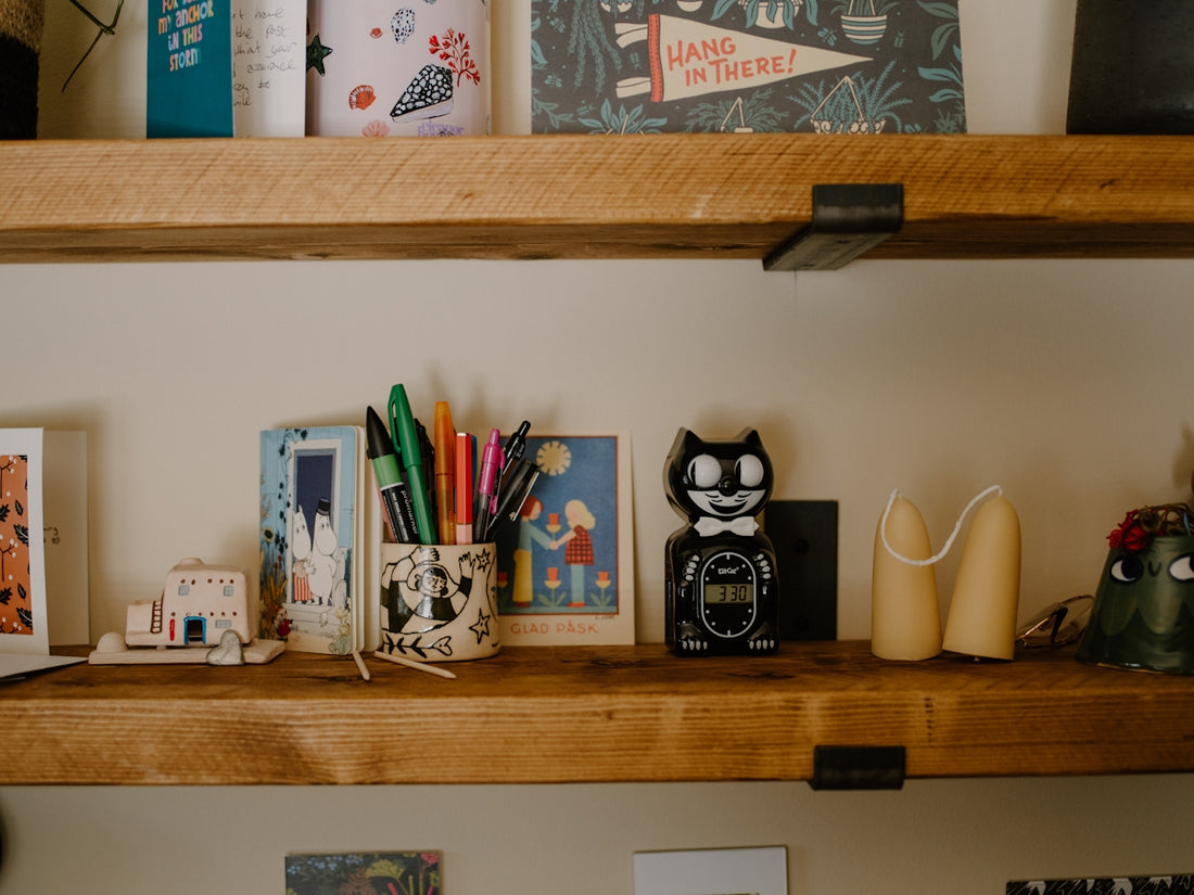 Desk shelves with various decorative items and art supplies.
